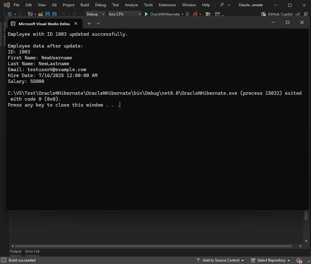 Visual Studio Debug console showing Oracle NHibernate update output for employee record