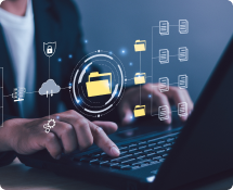 Hands typing on laptop with data